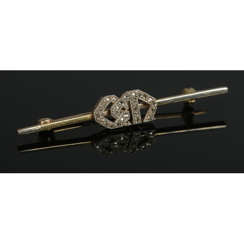 364 - An 18ct Gold and Platinum bar brooch set with diamond monogram 'GM'. Total weight: 2.8g