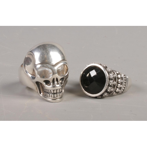 379 - Two silver Thomas Sabo skull rings. Sizes S and Y. 37.42g.