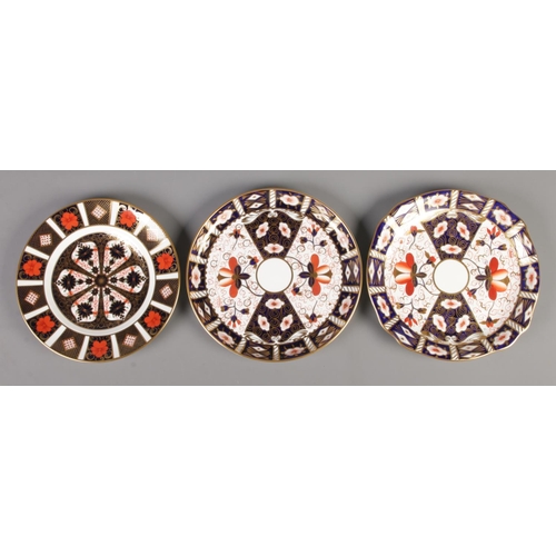 424 - Three Royal Crown Derby Plates in the Imari colours.