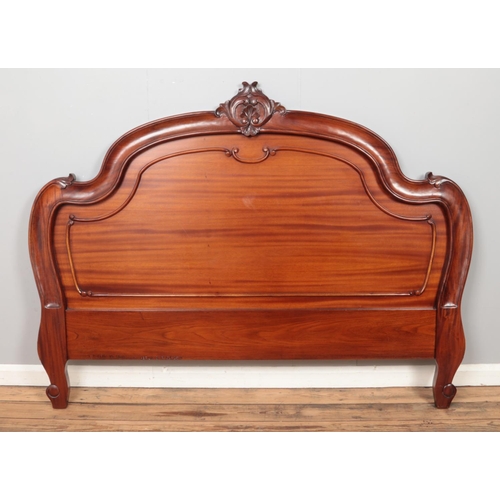 426 - A Victorian carved mahogany headboard.