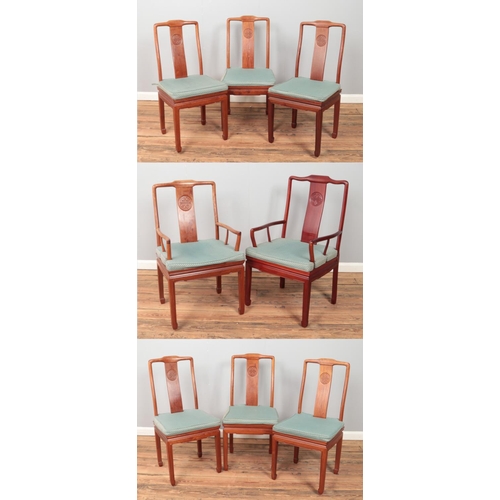 430 - A set of eight Chinese hardwood dining chairs with carved detailing to back splat. Includes two carv... 