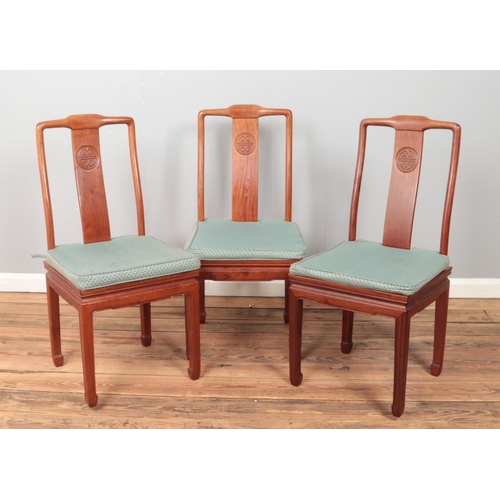 430 - A set of eight Chinese hardwood dining chairs with carved detailing to back splat. Includes two carv... 