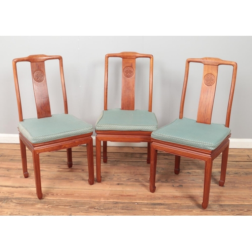 430 - A set of eight Chinese hardwood dining chairs with carved detailing to back splat. Includes two carv... 