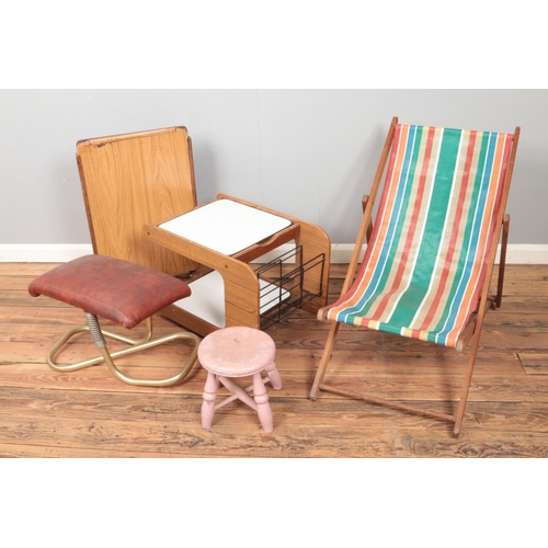 438 - Collection of assorted furniture to include deck chair, footstool and retro table.