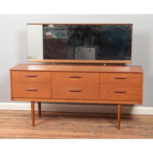 447 - A two piece retro vintage teak bedroom set including wardrobe with semi-fitted interior and dressing... 