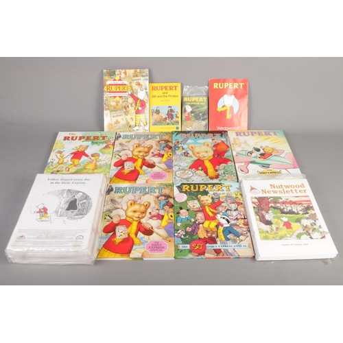 528 - A quantity of Rupert annuals and books. Includes Rupert the 50th daily express annual, Nutwood Newsl... 