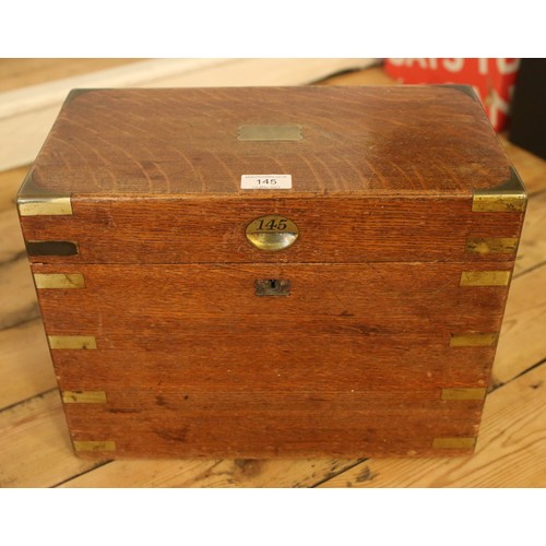 145 - A Victorian brass bound oak box. Numbered 145 and dated 1854.