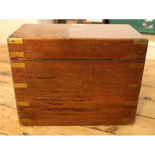 145 - A Victorian brass bound oak box. Numbered 145 and dated 1854.