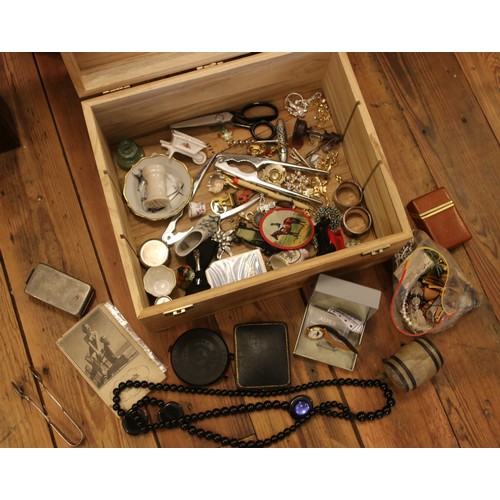 204 - A wooden box of collectables including costume jewellery, diecast cars, silver plate, etc.