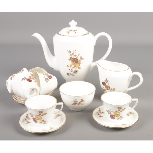 138 - A Royal Worcester coffee set decorated in the Golden Harvest pattern.