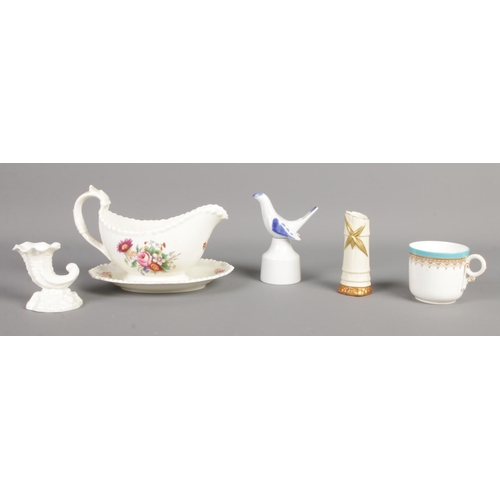 143 - A small collection of Royal Worcester ceramics. Includes 1885 gilt decorated teacup, 1049 bamboo vas... 