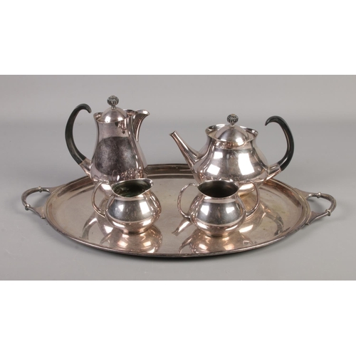 144 - A four piece Eric Clements for Mappin & Webb silver plated tea service with tray.