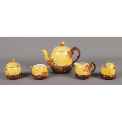 149 - A Burleigh ware five piece oak and acorn part tea set. Includes teapot, cream jug and condiment set.