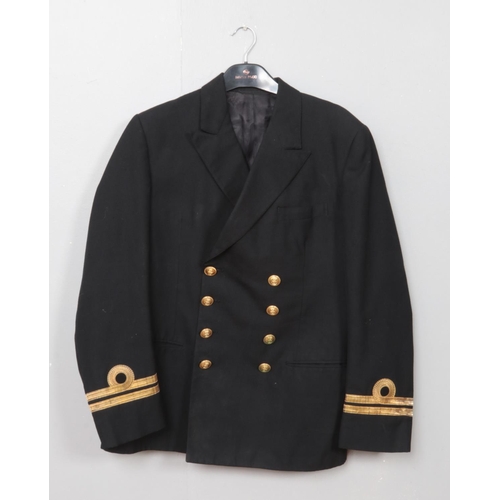 307 - A Royal Navy Lieutenants jacket. Bearing label for Gieves Limited, London.