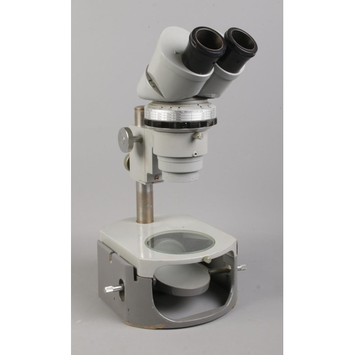 107 - A Nikon binocular microscope No. 73026.