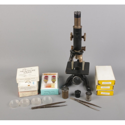 111 - W. Watson & Sons Kima microscope along with assorted microscope slides including blanks, plants and ... 