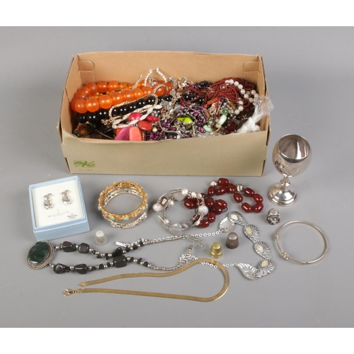 137 - A collection of costume jewellery including earrings, assorted bracelets, beaded necklaces, etc.