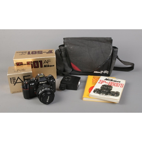 14 - A Nikon F-501 SLR camera with Nikkor 35-70mm F/3.3-4.5 lens (both boxed), Sunpak GX24, carry case an... 