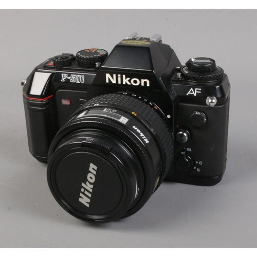 14 - A Nikon F-501 SLR camera with Nikkor 35-70mm F/3.3-4.5 lens (both boxed), Sunpak GX24, carry case an... 