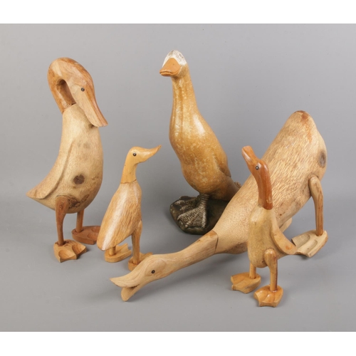 151 - Wooden ducks (4) with a single painted stone duck