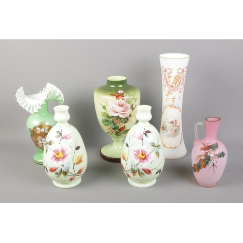20 - A collection of Victorian coloured glassware vases including painted floral examples.