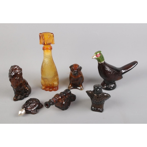 23 - A collection of Avon aftershave bottles including pheasant, turtle and canon examples.