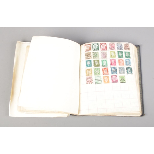 27 - A Quickchange illustrated stamp album containing a collection of world stamps including British, Arg... 