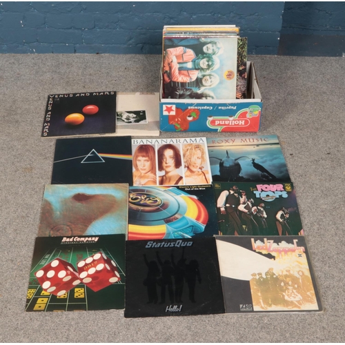 180 - A collection of vinyl records of mainly pop and rock examples to include Pink Floyd, Led Zeppelin, B... 