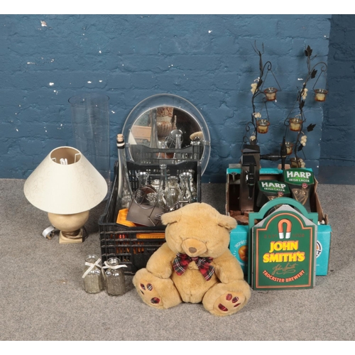 197 - Two boxes of miscellaneous to include table lamp, glassware, soft toy, beer taps, etc.