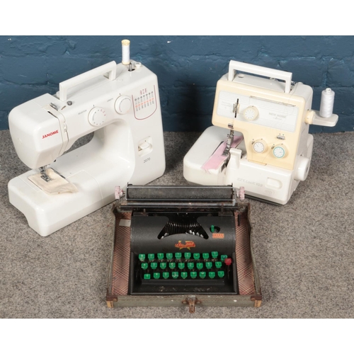 198 - Two Janome sewing machines along with a cased Lilliput type writer.