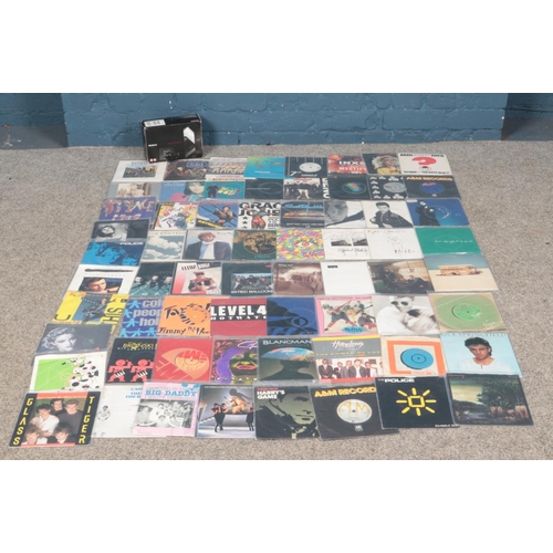 201 - A box of mainly 80's rock and roll single vinyl records, together with boxed Sony Network Walkman (N... 