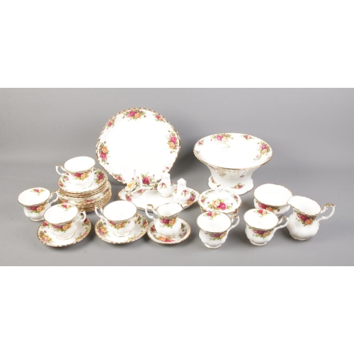 30 - A collection of Royal Albert Old Country Roses including tea cups, salt and pepper shakers, planter ... 