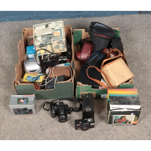 214 - Two boxes of assorted cameras including Nikon Coolpix P530, Polaroid, Kodak Brownie, etc.