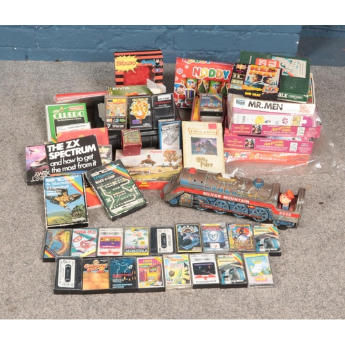 218 - Collection of vintage toys including Silver Mountain train, various spectrum games and puzzles.