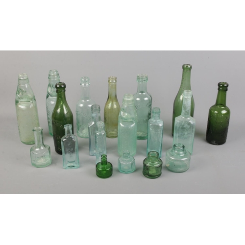 225 - A collection of vintage glass bottles including Ramune and brewery examples.