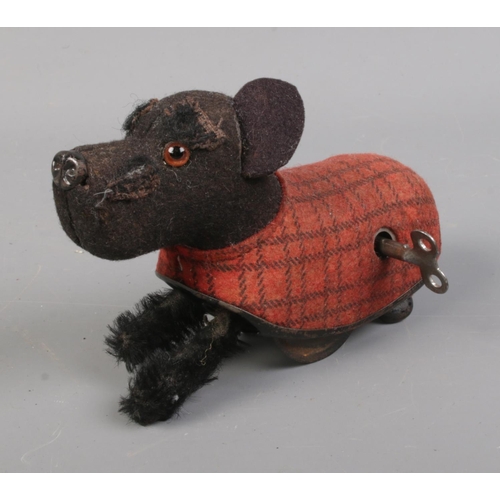 32 - A Schuco wind up Scottish Highland Terrier with key.