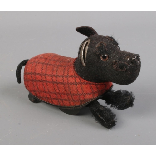 32 - A Schuco wind up Scottish Highland Terrier with key.