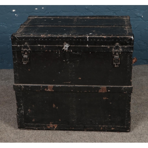 245 - A painted metal bound trunk. Approx. dimensions 57cm x 50cm x 61.5cm.