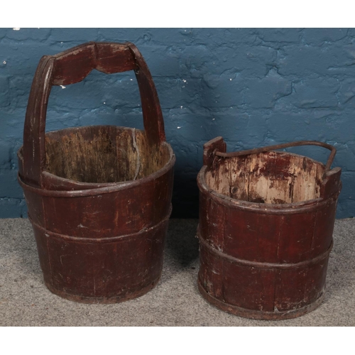 253 - Two wooden metal bound well buckets.