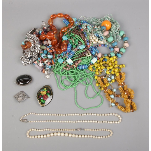 41 - A collection of costume jewellery to include silver clasped simulated pearl necklaces, hand painted ... 