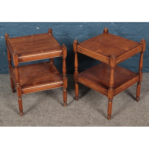 272 - A pair of small walnut two tier occasional tables. (40cm x 31cm x 31cm)