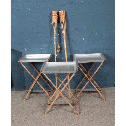 273 - A quantity of bamboo items including pair of Tiki torches and three folding tables.