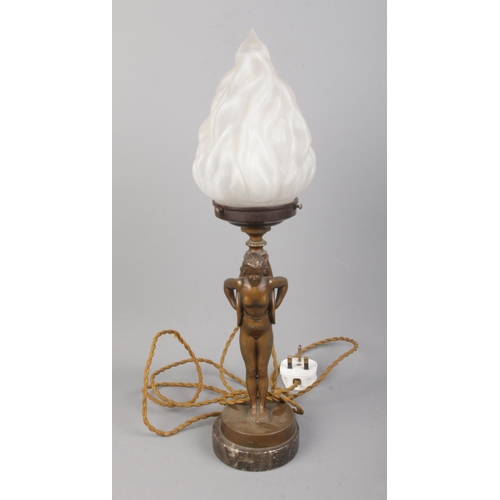 42 - An Art Deco style bronzed figural table lamp on marble base formed as a maiden carrying a torch.