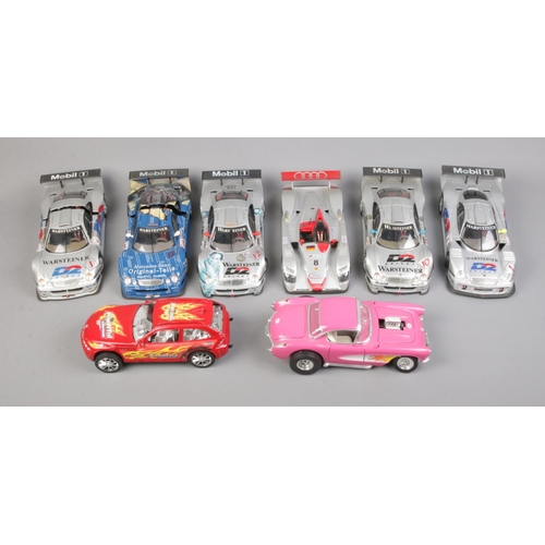 290 - Eight mostly 1/18 scale diecast racing cars including Audi R8 Le-Mans Sieger, Mercesdes Benz CLK-GTR... 