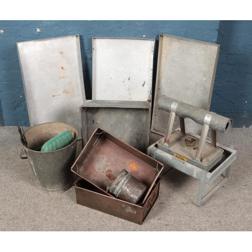 313 - A collection of metal trays and buckets including Eltex green house heater.