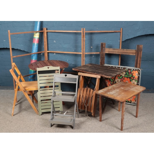 314 - An assortment of wooden garden furniture including clothes horse, tables and chair.