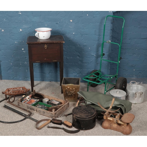 319 - A collection of miscellaneous. Includes fishing trolley & waders, crate, metal box, brushes baring t... 