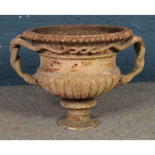 328 - A Victorian cast iron, twin handled planter. Approx. dimensions 75cm x 55cm.