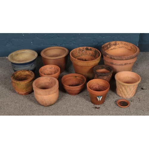 330 - A collection of terracotta planters of varying sizes to include decorative lattice work example.