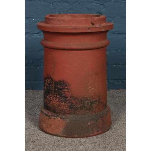 331 - A terracotta chimney pot/garden planter. Approx. height 46.5cm.